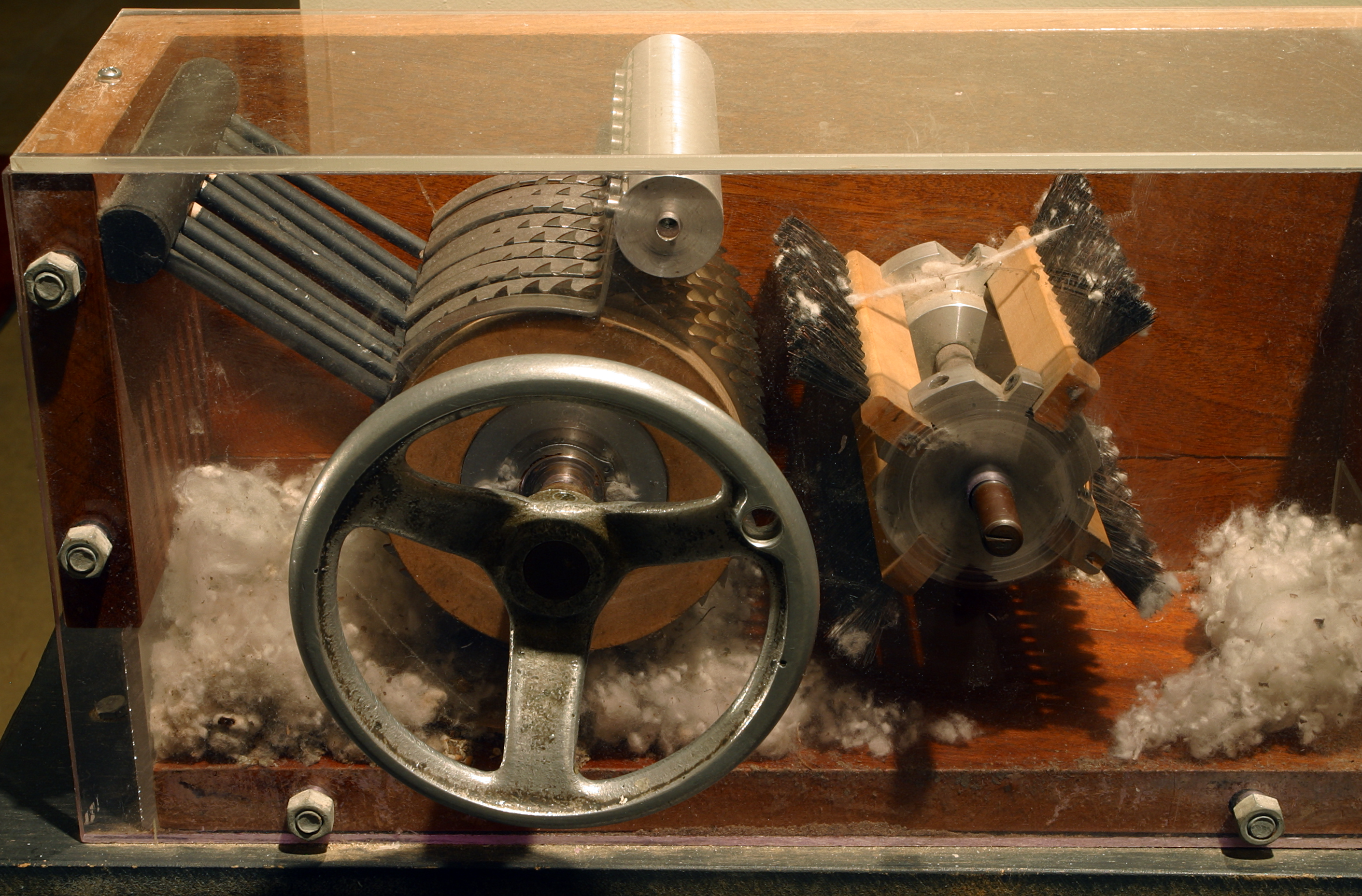 These balls are put in an industrial cotton gin, which separates the seeds from the balls, creating pure cotton.