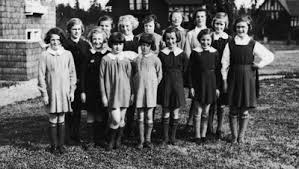 Girls always wore dresses to school with knee stockings and oxford-type shoes or high top shoes