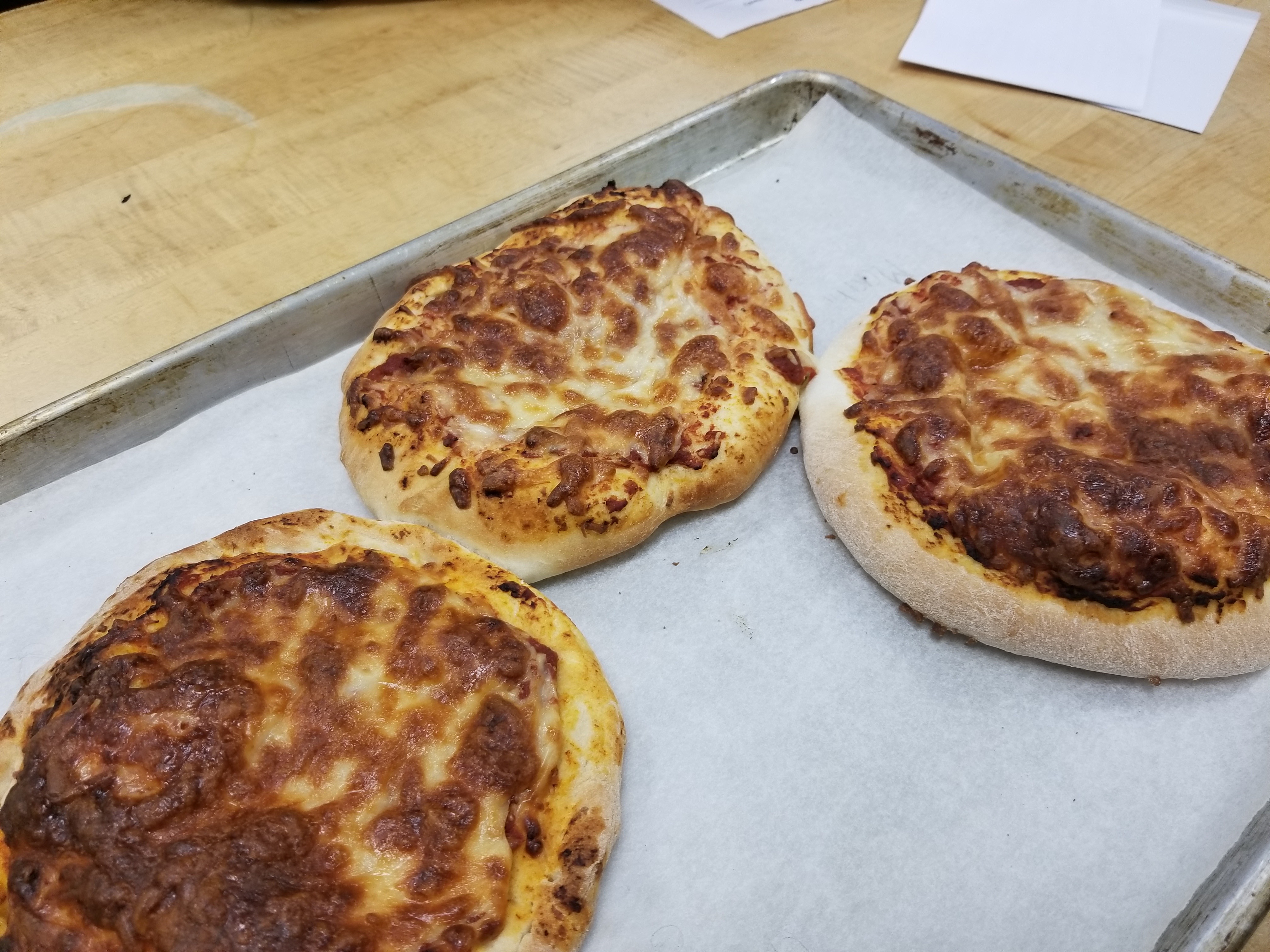 Making Pizza Our last task was to make pizza. Some of the ingredients we used were: Active dry yeast, White sugar, Warm water