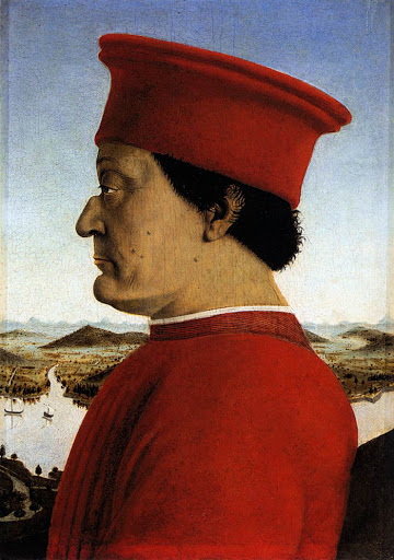 FEDERICO - presenta il volto segnato da rughe e verruche, indossa berretto e veste rossa