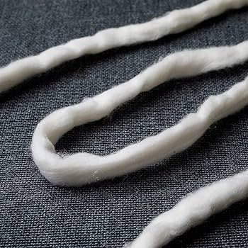 The cotton is blended, carded, combed, pulled, stretched, and finally twisted by high-tech machines, which the convert the ma